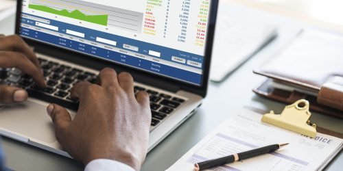 Black businessman using computer laptop